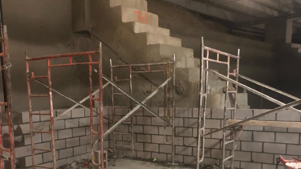 Scaffolded Demolition Area With Concrete Stairs